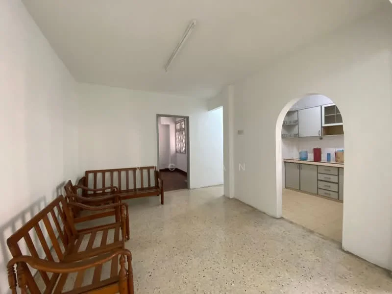 Room features: white painted walls, polished concrete flooring, 2 wooden benches, arched doorway leading to kitchen, natural light from adjacent room, neutral color scheme, fluorescent ceiling light; style: minimalist.