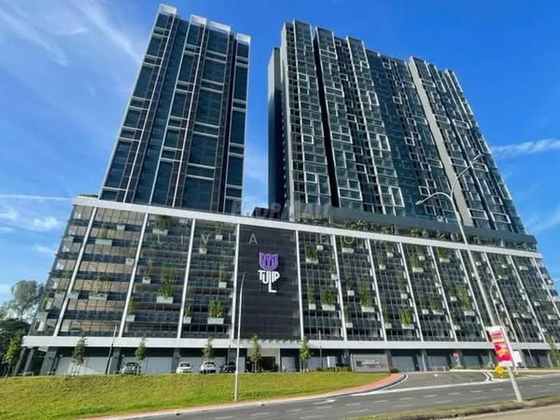 Exterior type: high-rise condominium; features: glass curtain wall, greenery on balconies, multiple recessed balconies, modern facade with geometric patterns, signage with 'TULIP', surrounded by landscaped areas, multiple storeys, urban context with clear blue sky; style: modern.