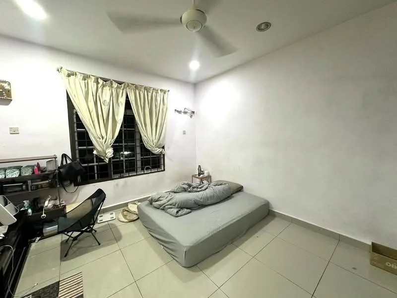 Bedroom features: grey bedding, single bed mattress on the floor, white painted walls, ceiling fan, black window with grilles, curtains in cream color, tiled flooring, desk with chair, small decorative items on desk, floor mat, wall-mounted light fixture; style: minimalist.