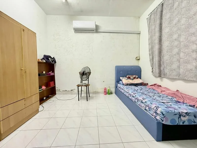Bedroom features: single bed with floral bedding, wooden wardrobe with sliding doors, wooden bookshelf, chair, wall-mounted split AC, tile flooring, white painted walls, curtains, fan, pink blanket.