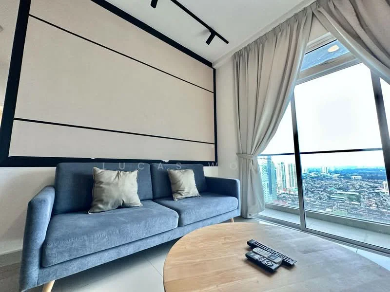 Living features: grey fabric 3-seater sofa, two decorative cushions, round wooden coffee table, floor-to-ceiling windows, city skyline view, light-colored walls, black accent wall, curtains, recessed ceiling lights; style: modern; view: city.