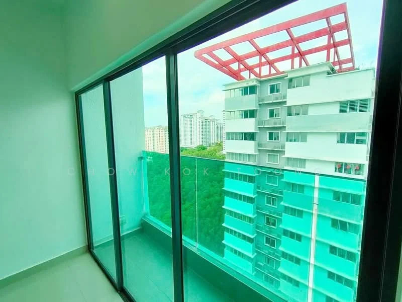 Room features: floor-to-ceiling windows, glass balcony railing, grey tiled flooring, green view, red roof structure visible, city skyline in background; style: modern; view: city.