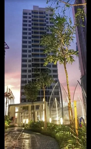 Exterior type: high-rise condominium; features: glass curtain wall, white painted facade, recessed balconies, landscaped garden with trees, pathway with stone paving, feature lighting, main entrance with glass doors, surrounded by greenery; style: modern.