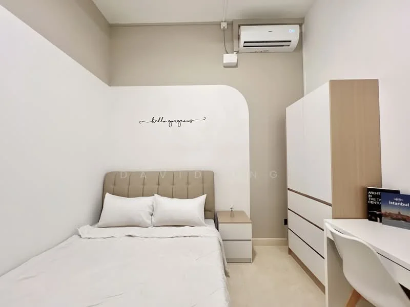 Bedroom features: queen-size bed with upholstered headboard, white bedding, nightstand with drawer, built-in wardrobe, study desk with chair, wall-mounted air conditioning unit, decorative wall art with text, light-colored walls, cream-colored flooring; style: modern.