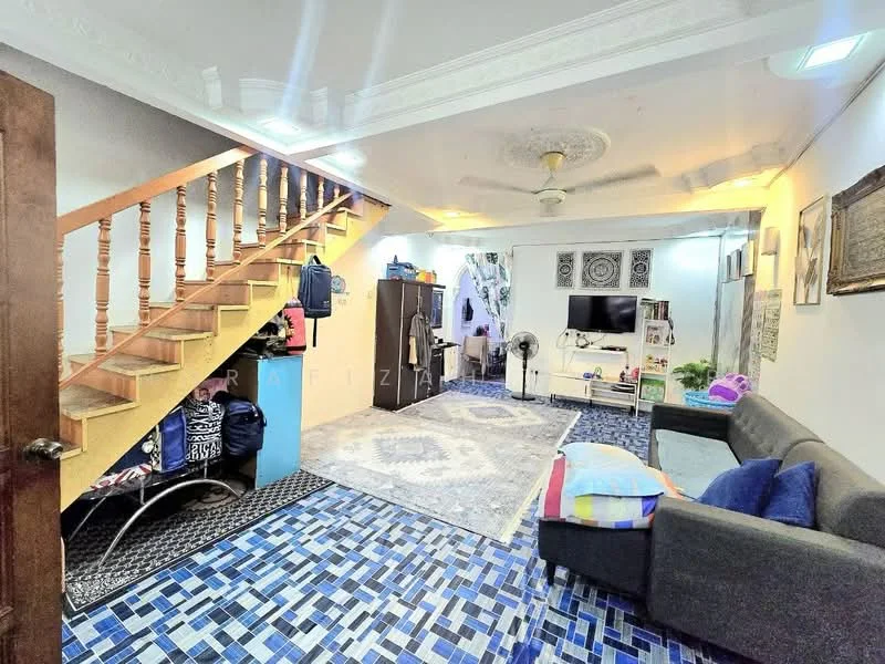 Living features: blue and white patterned tile flooring, white painted walls, ceiling fan with light, sofa in grey, coffee table, wall-mounted TV, entertainment unit, area rug with geometric pattern, staircase with wooden railing, decorative wall art, open shelving, window with sheer curtains; style: modern.