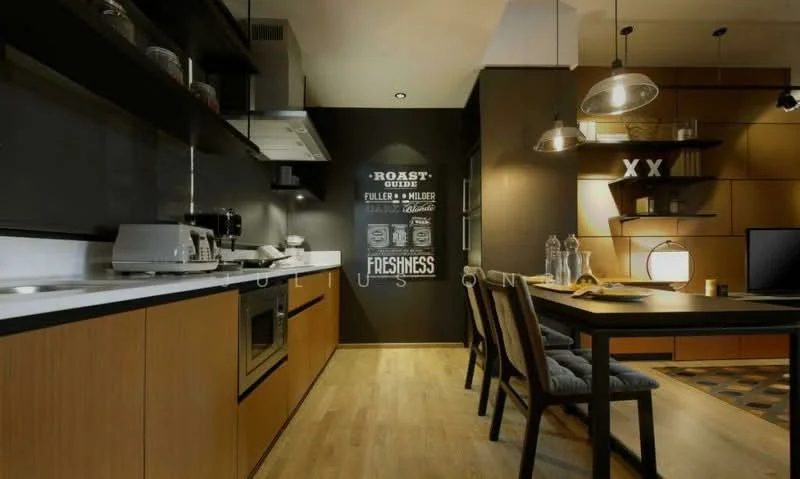 Kitchen features: white cabinetry, black accent wall, stainless-steel built-in oven, stainless-steel microwave, 4-burner gas hob, stainless-steel range hood, black countertop, wooden flooring, pendant lighting, dining table with grey upholstered chairs, decorative wall art, open shelving; style: modern.