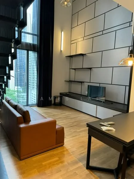 Living features: brown leather sofa, wooden flooring, floor-to-ceiling windows, black wall-mounted TV console, white wall with geometric paneling, black shelving units, recessed downlights, black desk, decorative table lamp; style: modern; view: city.