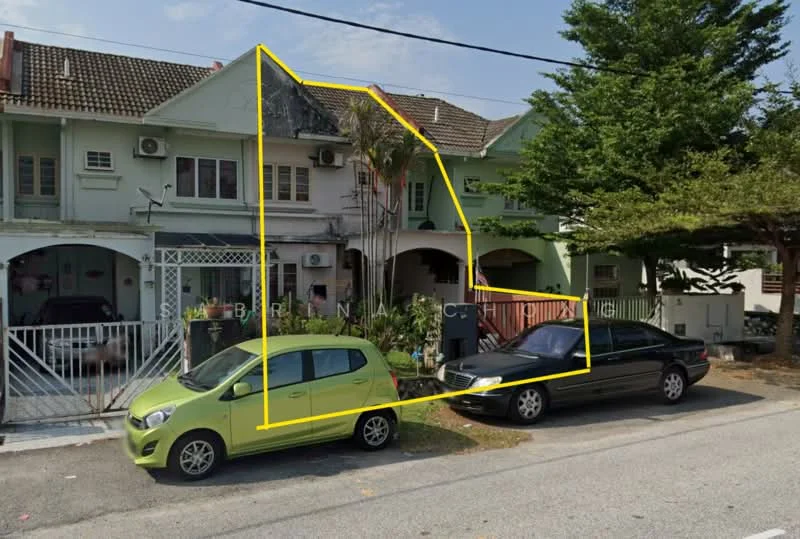 Exterior type: linked terrace house; features: two-storey building, green painted facade, white window frames, balcony on the upper floor, manicured front garden, paved driveway, two parked cars, air conditioning units visible, fence at the front, mature trees in the vicinity; style: modern.