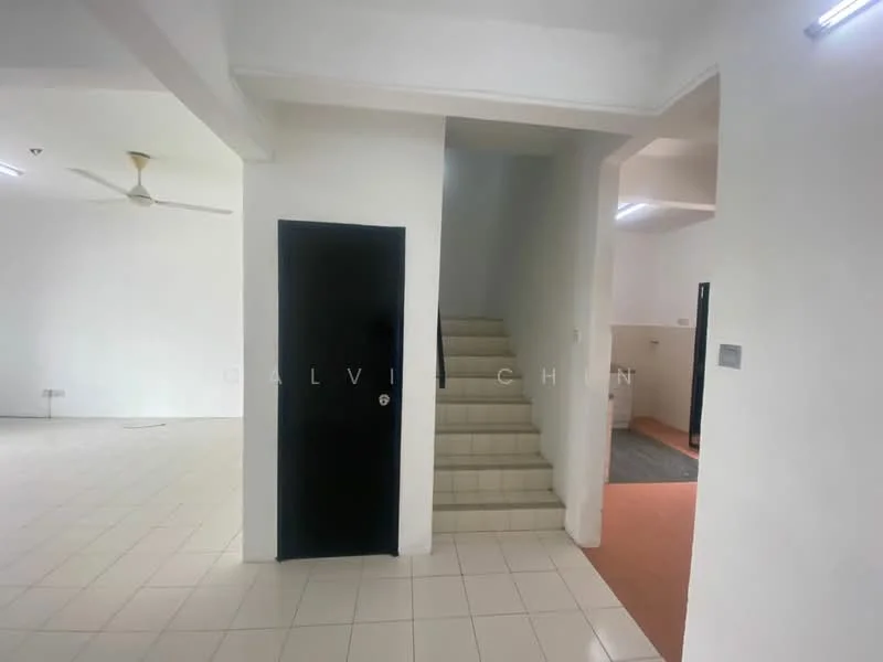 Room features: white painted walls, tiled flooring, staircase leading to upper floor, black door, ceiling fan, recessed lighting, open layout, neutral color scheme; style: modern.