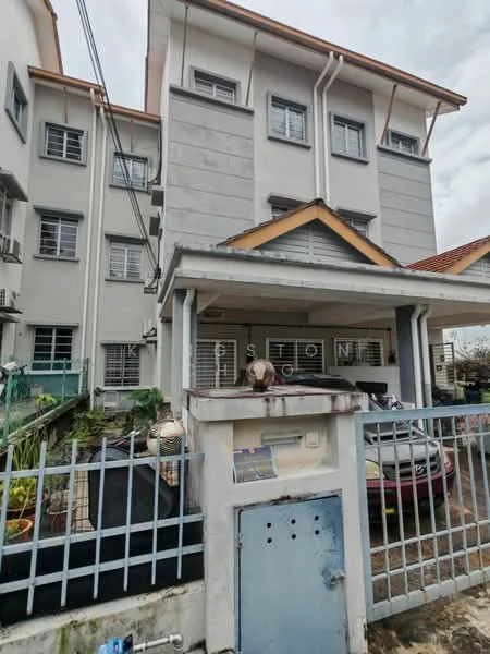 Exterior type: low-rise apartment block; features: grey painted facade, flat roof, 3-storey building, gated entrance, fenced perimeter, parking area visible, balconies on upper floors, multiple air conditioning units, front porch with roof, driveway with interlocking pavers; style: modern.