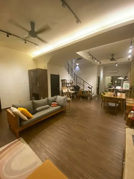 Living features: 3-seater fabric sofa in grey, decorative cushions, wooden coffee table, area rug with geometric pattern, ceiling fan, recessed LED downlights, wooden flooring, open layout, staircase in background, wall-mounted shelves, dining area visible, large windows, neutral wall colour; style: modern.