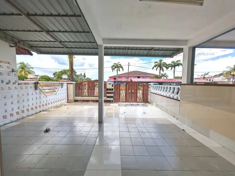 Exterior features: covered terrace, grey tiled flooring, white wall cladding, wooden gate, palm trees visible, open space, metal roof, fenced perimeter; style: modern.