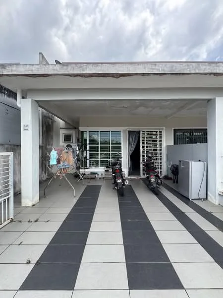 Exterior type: detached bungalow; features: flat roof, white painted facade, large windows with grilles, paved driveway, two parked motorcycles, outdoor laundry area with drying rack, grey refrigerator, concrete flooring, minimal landscaping; style: modern.