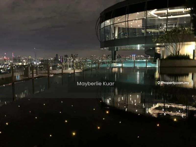 Exterior type: high-rise condominium; features: infinity pool, pool deck with loungers, city skyline view, glass curtain wall, outdoor lighting, landscaping with plants, water feature, recessed balconies; style: modern.