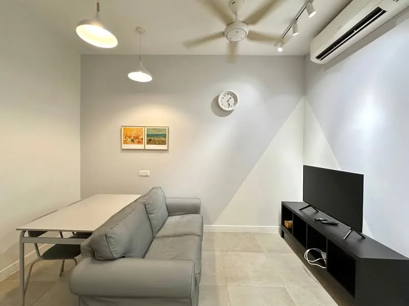 Living features: grey fabric sofa, coffee table, wall-mounted TV, TV console with storage, ceiling fan, recessed downlights, wall clock, two framed artworks, light grey painted walls, cream tiled flooring, air conditioning unit; style: modern.