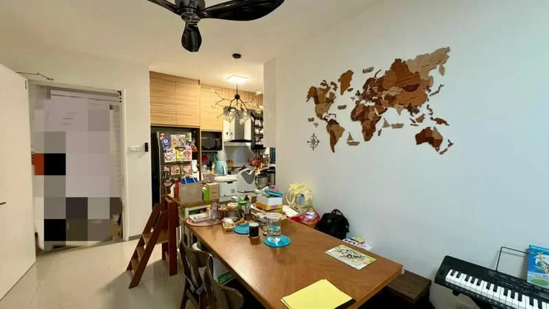 Dining features: wood dining table, 8 dining chairs, black ceiling fan, wooden world map wall decor, white painted walls, tile flooring, kitchen area visible in background, refrigerator with magnets, decorative items on table, piano in corner; style: modern.