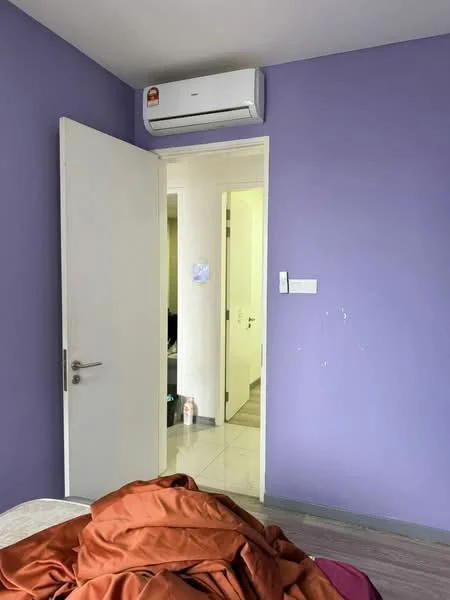 Room features: purple painted walls, white door, 1 wall-mounted split AC, light-colored flooring, doorway leading to another room.
