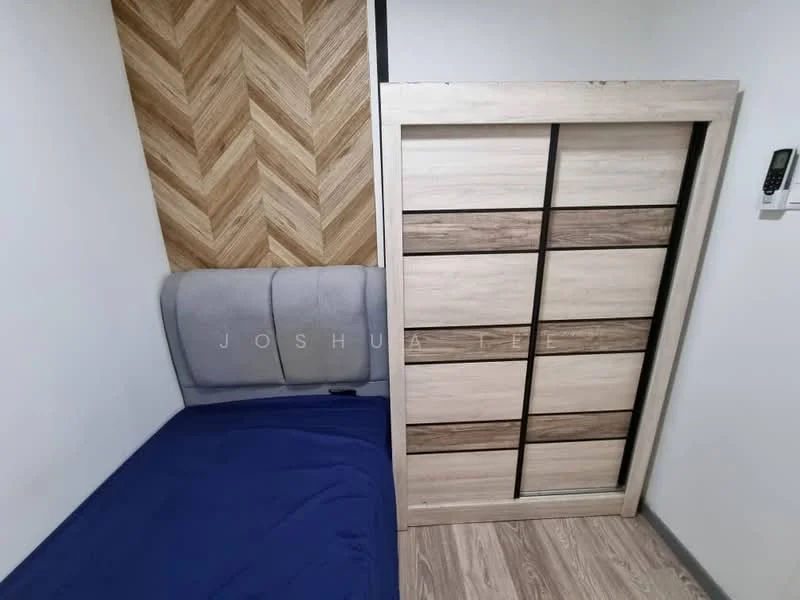 Bedroom features: grey upholstered headboard, blue bedspread, wood panel accent wall with herringbone pattern, built-in wardrobe with sliding doors, wooden flooring, wall-mounted air conditioning unit; style: modern.