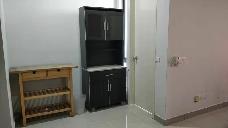 Room features: grey cabinetry with upper and lower storage, white countertop, wooden console table, tile flooring, white walls, door leading to another room, light switch on wall, waste bin; style: modern.
