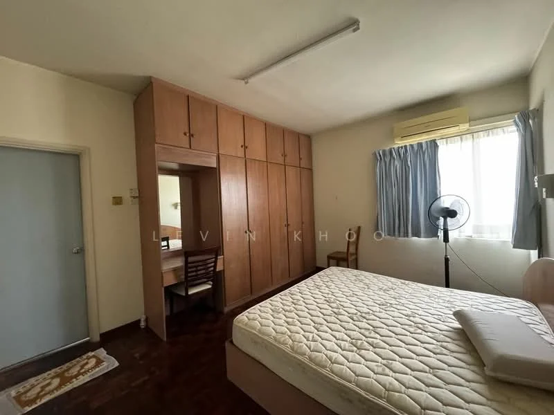 Bedroom features: queen-size bed, built-in wardrobe with wooden finish, study desk with chair, window with sheer curtains, ceiling light fixture, wooden flooring, air conditioning unit, decorative wall mirror.