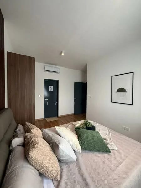 Bedroom features: king-size bed with upholstered headboard, decorative throw pillows, light grey bedding, wooden flooring, wall-mounted air conditioning unit, framed artwork on wall, dark blue doors, built-in wardrobe, natural light from window, neutral wall color; style: modern.
