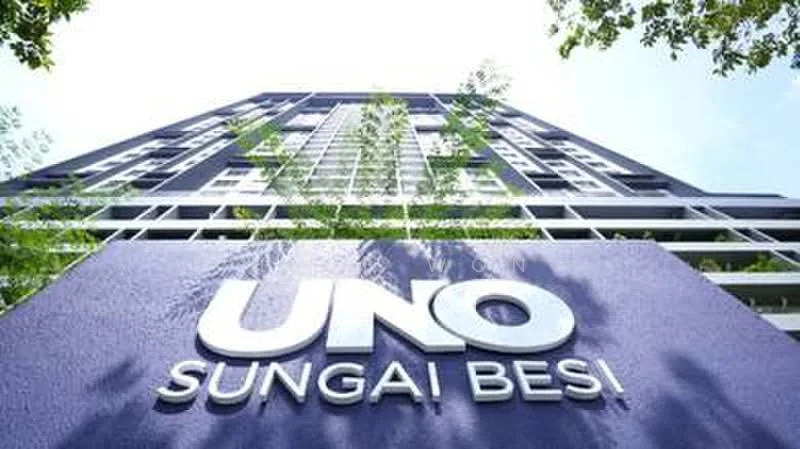 Exterior type: high-rise condominium; features: modern facade with purple accent, glass windows, greenery surrounding the base, multiple storeys, prominent signage, contemporary architectural design; style: modern.