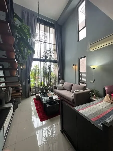 Living features: grey painted walls, high ceiling, large floor-to-ceiling windows, sheer curtains, 3-seater fabric sofa in light grey, coffee table, area rug in red, potted plants, floor lamp, wall-mounted air conditioning unit, decorative wall art, wooden staircase with planters; style: modern; view: garden.