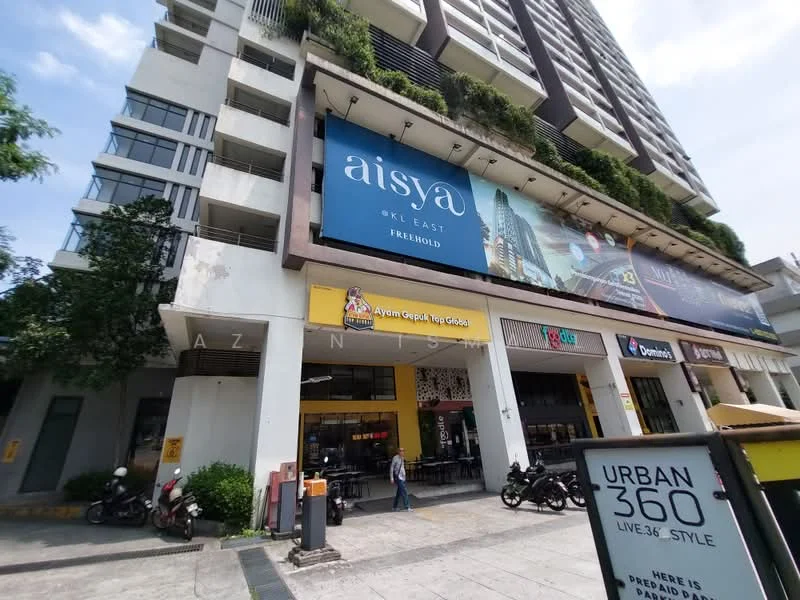 Exterior type: high-rise condominium; features: glass curtain wall, white painted facade, recessed balconies, vertical fins, signage on building, ground floor retail spaces, motorcycle parking, landscaped planters, entrance with awning; style: modern.
