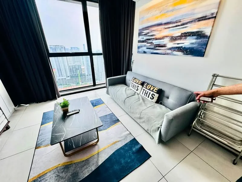 Living features: grey fabric sofa, coffee table with metal legs, area rug with geometric pattern, floor-to-ceiling windows, blackout curtains, decorative wall art, plant in ceramic pot, tiled flooring; style: modern; view: city.