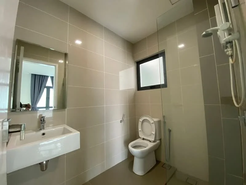Bathroom features: white ceramic toilet, single-sink vanity with wall-mounted faucet, mirror above sink, glass shower enclosure, grey tiled walls, light grey tiled flooring, chrome showerhead, chrome towel rail; style: modern.