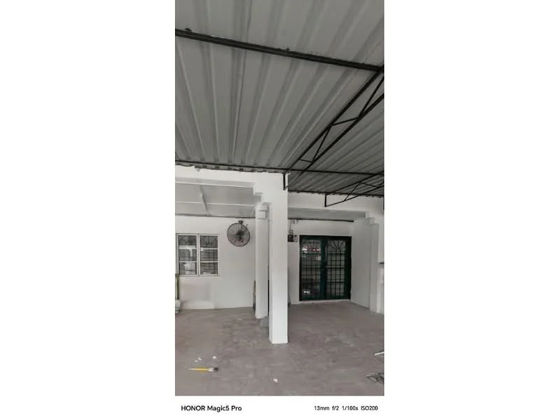 Room features: white painted walls, metal ceiling with exposed beams, concrete flooring, wall-mounted ceiling fan, black metal door with glass panels, multiple windows with grilles; style: modern.