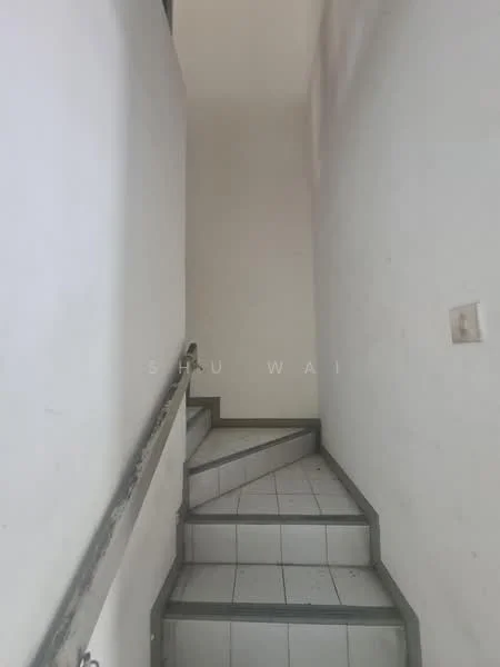 Room features: white painted walls, grey tiled flooring, metal handrail, staircase with steps, natural light from upper area.