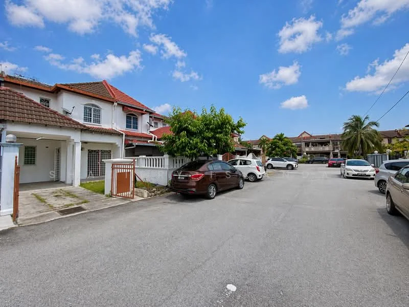 Exterior type: linked terrace house; features: red tiled roof, white painted facade, manicured lawn, paved driveway, surrounded by greenery, multiple parked cars, street view, two-storey houses, clear blue sky; style: modern.