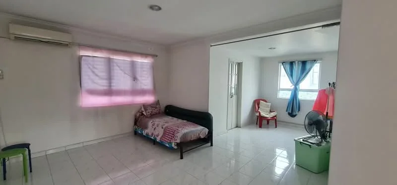 Room features: white painted walls, glossy tile flooring, 1 single bed with patterned bedding, 1 wall-mounted air conditioning unit, 1 window with sheer curtains, 2 chairs (1 red, 1 green), 1 standing fan, 1 door leading to another room, natural light from window, ceiling lights; style: modern.