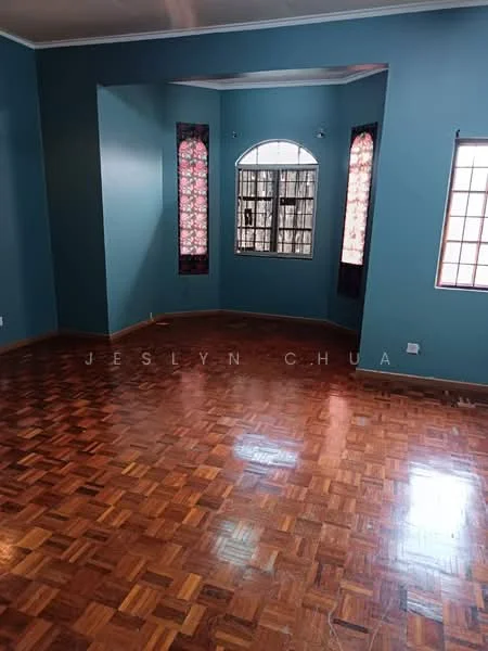 Room features: blue painted walls, parquet wood flooring, two windows with floral curtains, arched window, corner window, baseboards, no visible ceiling features, no visible furniture.