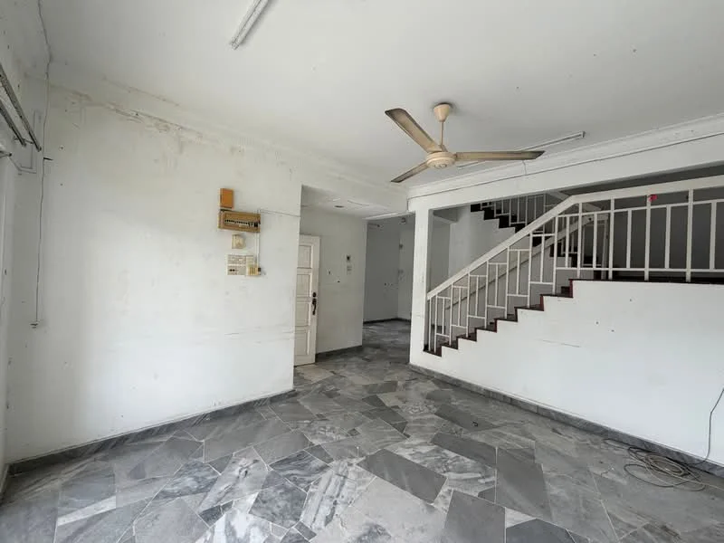 Living features: grey marble flooring, white painted walls, 5-blade ceiling fan, staircase with white railing, large window, doorway leading to another room, light fixture on ceiling, exposed electrical outlets.