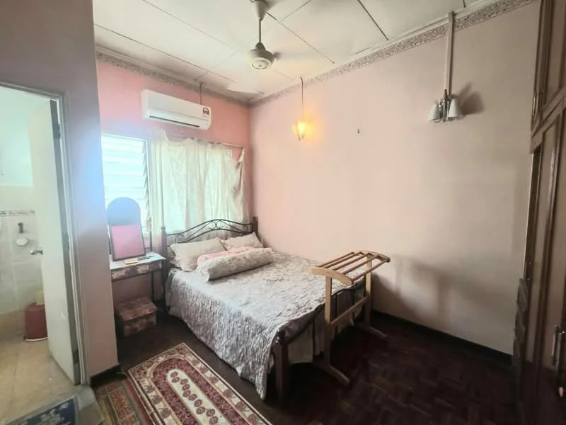 Bedroom features: queen-size bed, upholstered headboard, wooden flooring, wall-mounted split AC, ceiling fan, framed mirror on dressing table, built-in wardrobe, window with sheer curtains, decorative wall sconce, area rug with traditional pattern; style: traditional.