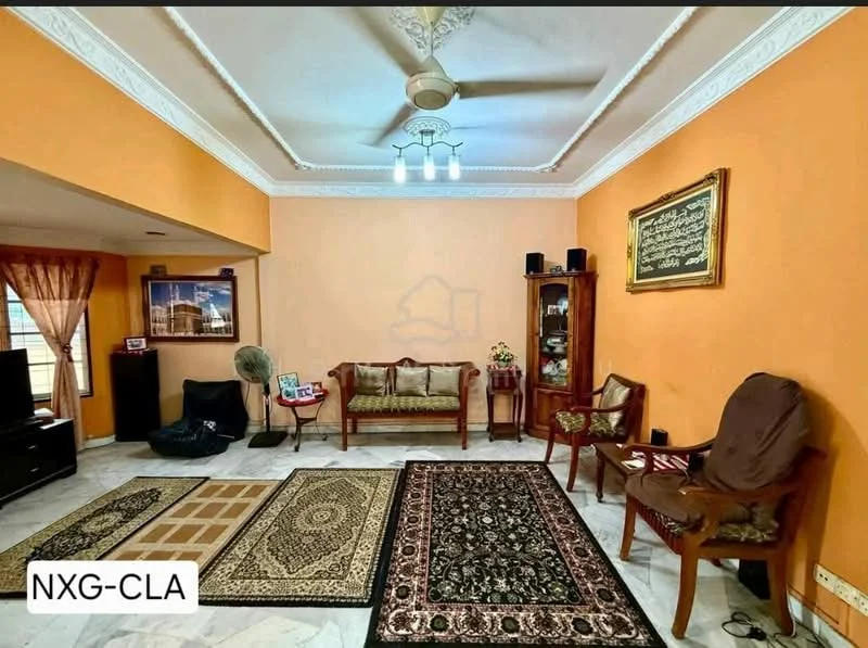 Living features: orange painted walls, marble flooring, tray ceiling, 5-blade ceiling fan with light, sofa with upholstery, wooden coffee table, area rug with geometric pattern, area rug with floral pattern, wooden side chairs, decorative wall art, curtains, wall-mounted shelf; style: traditional.