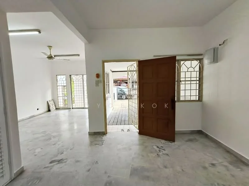 Room features: white painted walls, marble flooring, ceiling fan, double-door wooden entrance, large windows with metal grills, open layout, natural light, door leading to outdoor area; style: modern.