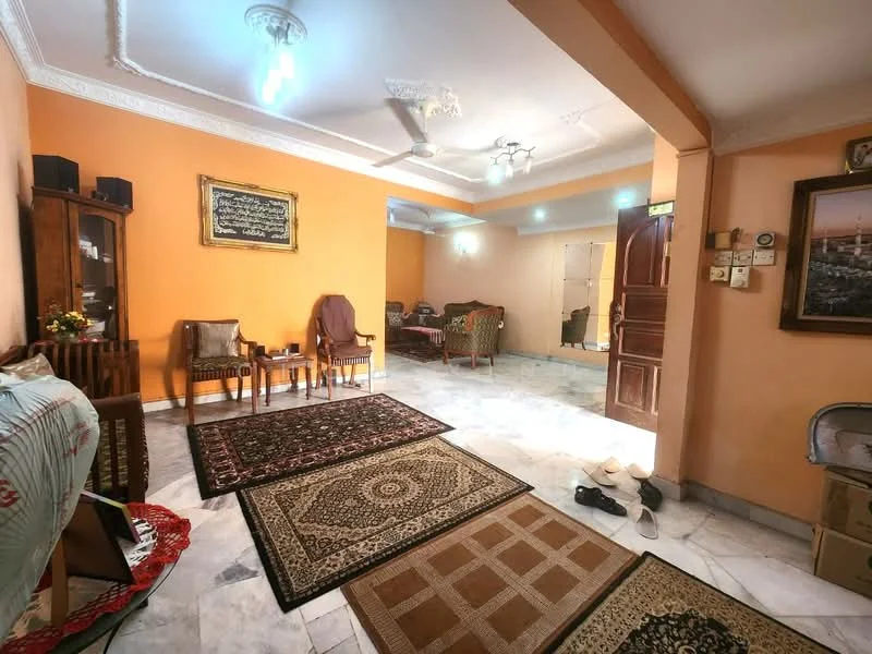 Living features: orange painted walls, marble flooring, 5-blade ceiling fan with light, recessed downlights, wooden furniture, decorative area rugs, framed artwork, wooden door, two-seater sofa, two armchairs, coffee table; style: traditional.