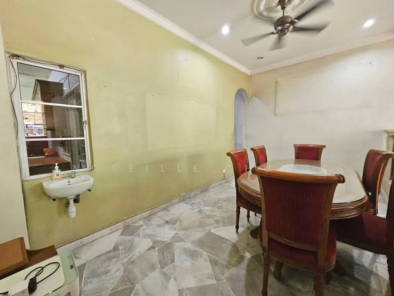 Dining features: round dining table, upholstered dining chairs, ceiling fan, marble flooring, green painted walls, wall-mounted sink, arched doorway, decorative crown moulding; style: traditional.