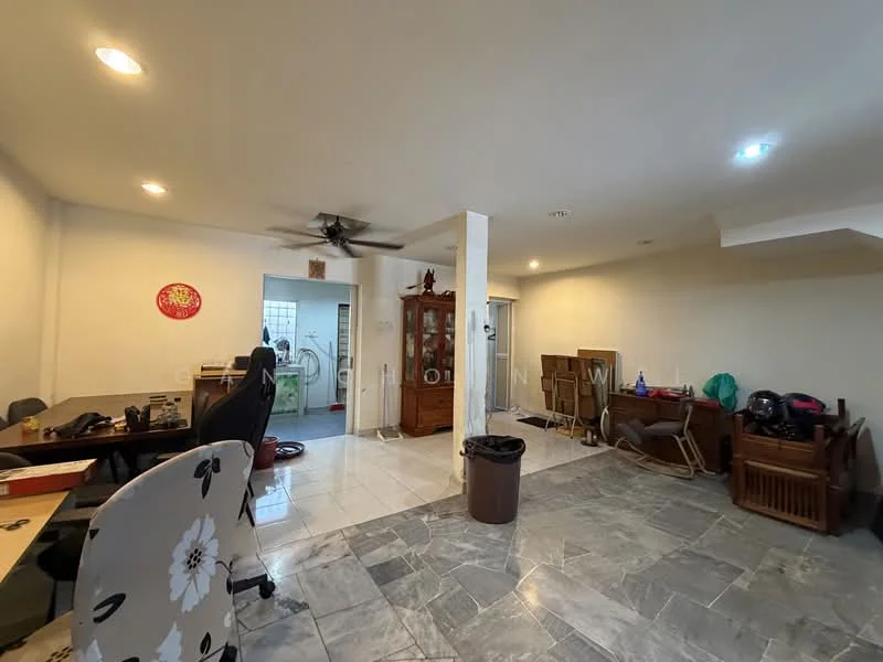Room features: white painted walls, grey marble flooring, 5-blade ceiling fan, recessed downlights, wooden display cabinet, office desk with chair, plastic trash bin, various furniture items, laundry area visible in background; style: modern.