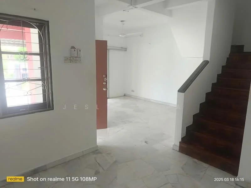 Room features: white painted walls, marble tile flooring, staircase with wooden steps, ceiling fan, window with metal grille, door with multiple panels, light fixture on ceiling.