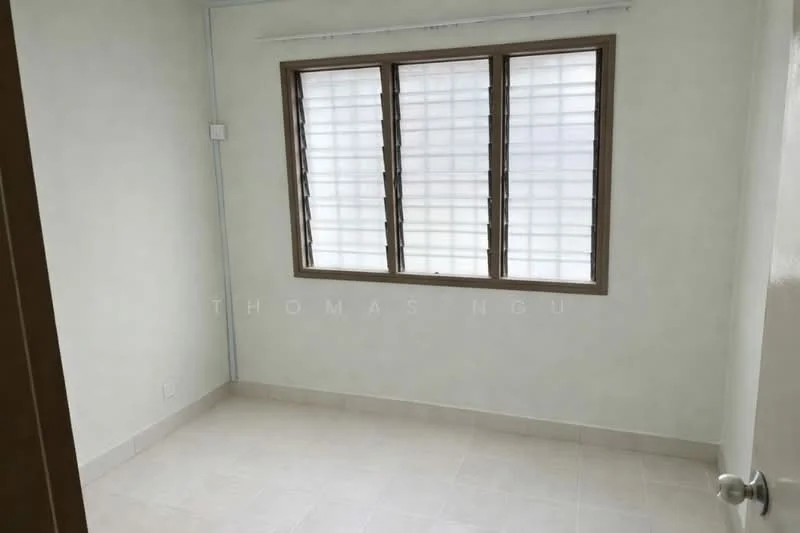 Room features: white painted walls, tile flooring, window with grid pattern, natural light from window, light switch, neutral color scheme, no visible furniture, simple ceiling; style: minimalist.