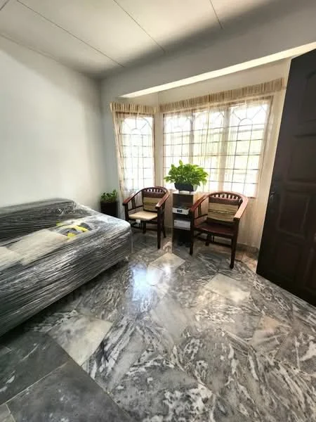 Room features: marble flooring, white painted walls, large windows with grid pattern, two wooden chairs, small potted plant, wooden door, wrapped sofa, natural light from windows; style: modern; view: garden.