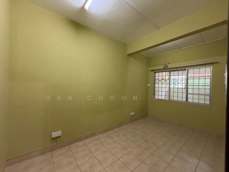 Room features: green painted walls, tile flooring, window with grid design, ceiling light fixture, corner location, no visible furniture, neutral decor, single window.
