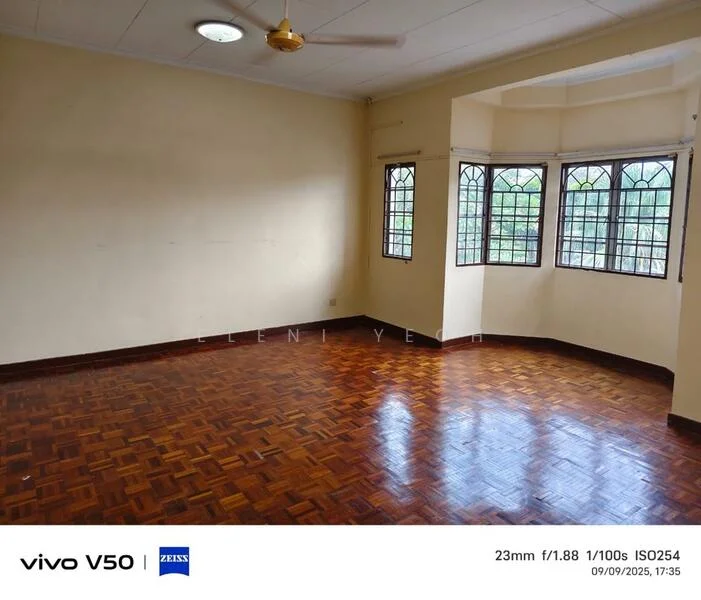 Room features: wooden flooring, cream painted walls, ceiling fan, multiple windows, bay window with three panes, natural light, high ceiling, no visible furniture; view: garden.