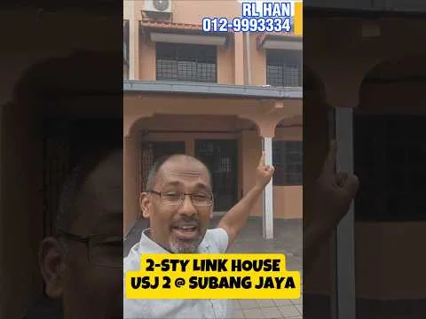 Exterior type: linked terrace house; features: 2-storey structure, cream painted facade, metal grille windows, tiled roof, paved walkway, front porch, air conditioning unit visible, gated entrance; style: modern.