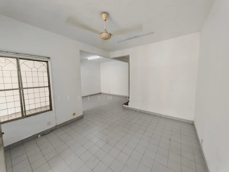 Room features: white painted walls, grey tiled flooring, ceiling fan, window with grid pattern, natural light from window, open layout, no visible furniture, plain ceiling; style: minimalist.
