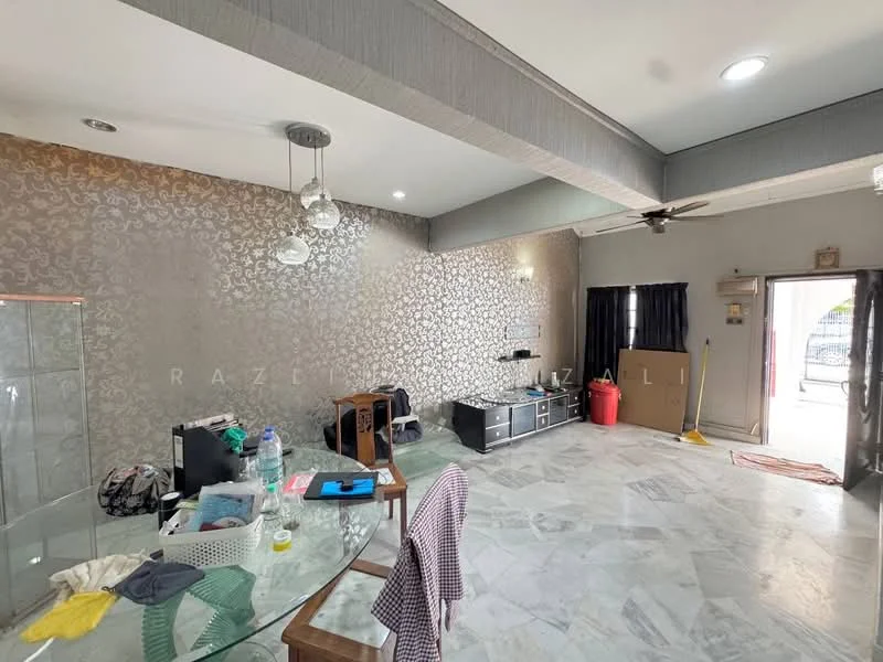 Room features: marble flooring, grey painted walls with decorative pattern, ceiling with recessed downlights, ceiling fan, large window with black curtains, glass door, dining table with chairs, TV console, decorative wall, cleaning supplies visible, plastic water bottle, wooden cabinet, area rug; style: modern.